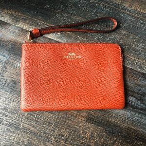 Authentic burnt orange Coach wristlet